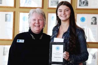 Parham’s Tangie Howes received her award from past president Corie Abrams.
